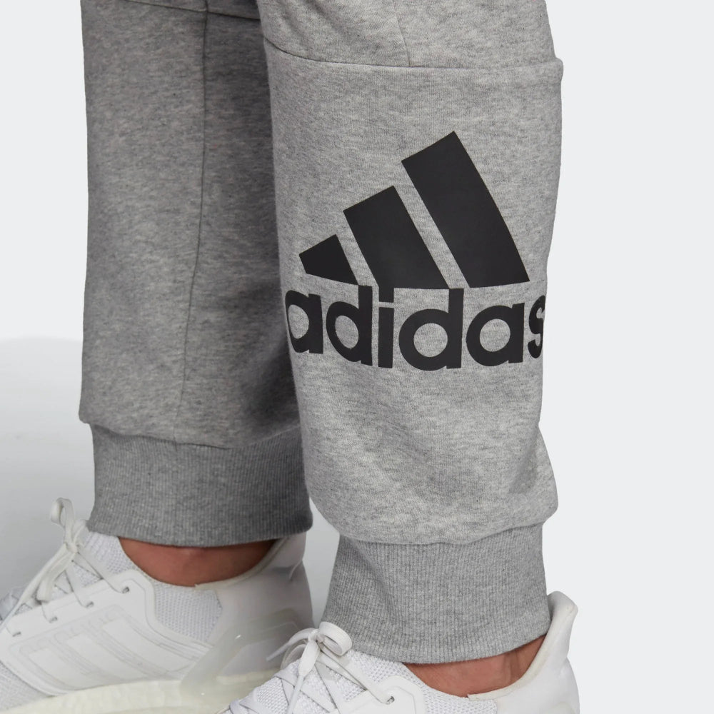 A close-up of the screen-printed Badge of Sport and the textured marl fabric.