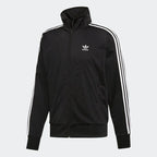 Adidas Firebird Track Jacket Men's in black, front view showing full zip, stand-up collar, white 3-Stripes on sleeves, and embroidered Trefoil logo.