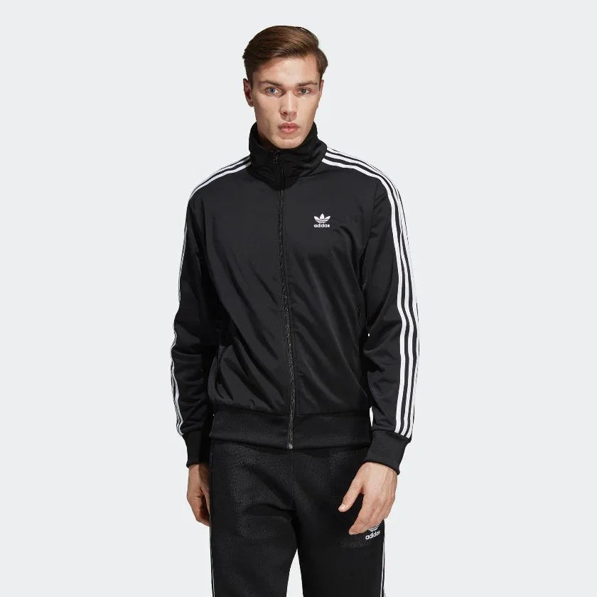 Adidas Firebird Track Jacket Men's in black, front view showing full zip, stand-up collar, white 3-Stripes on sleeves, and embroidered Trefoil logo. Main image