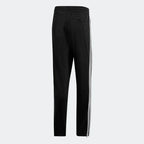 Adidas Firebird Track Pants Men's in black, back view showcasing the tapered leg fit and ribbed cuffs.