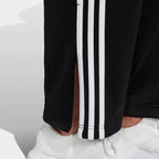 Detailed zoom on the ribbed ankle cuff of the Adidas Firebird Track Pants, highlighting the adjustable fit and clean finish.
