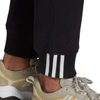 Detailed zoom on the elastic waistband with drawcord or the ribbed cuff of the Adidas R.Y.V. Sweat Pants, highlighting the textured fabric.