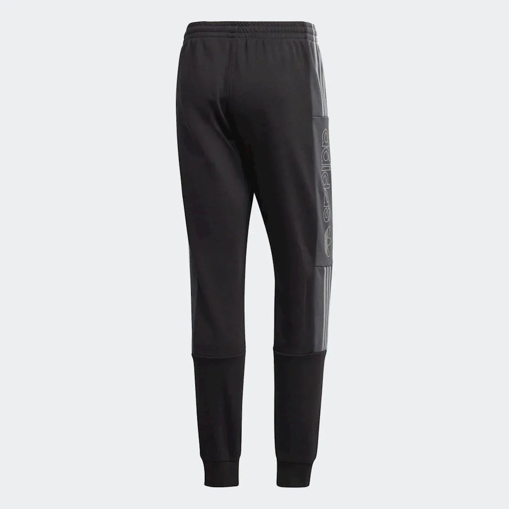 Focusing on the mid-rise waistband and the clean, structured seat.