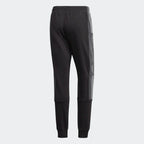 Focusing on the mid-rise waistband and the clean, structured seat.