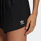 Close-up of adidas Adicolor 3-Stripes Women's Shorts GN2885 cotton fabric with Trefoil logo detail