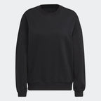 Focuses on the ribbed crewneck and the high-quality knit texture.