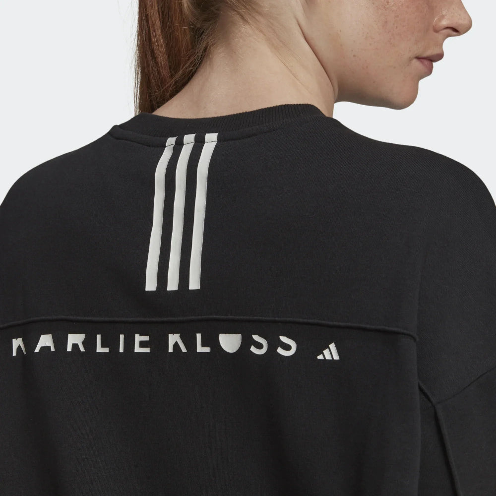 Focusing on the clean, minimalist back and the structured ribbed hem.