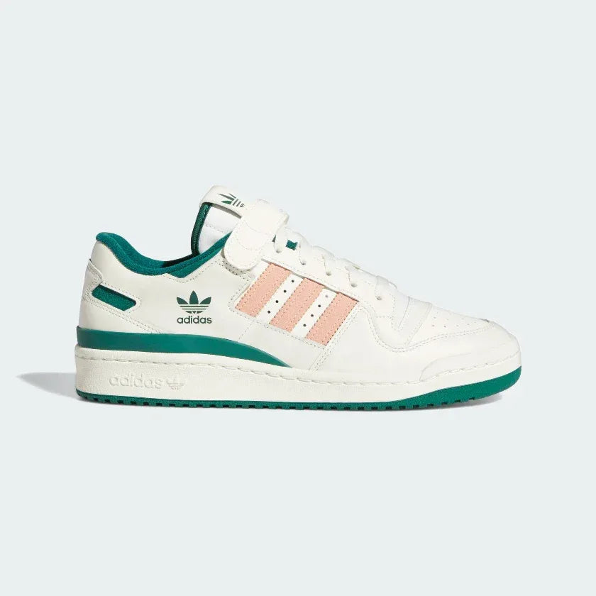 Adidas Forum 84 Low Men's trainers in off-white/cream leather, side profile showing iconic X-detail, hook-and-loop ankle strap, and classic silhouette. Main image