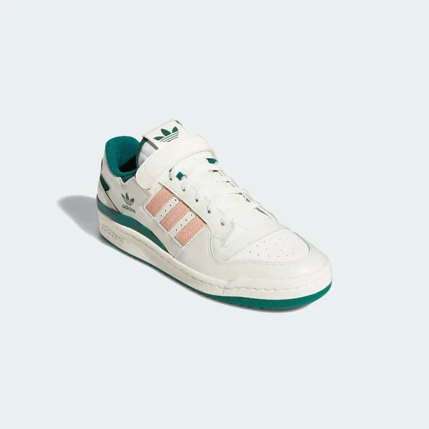 Angled view of two Adidas Forum 84 Low Men's off-white leather trainers, side by side, showcasing their iconic retro design and premium finish.