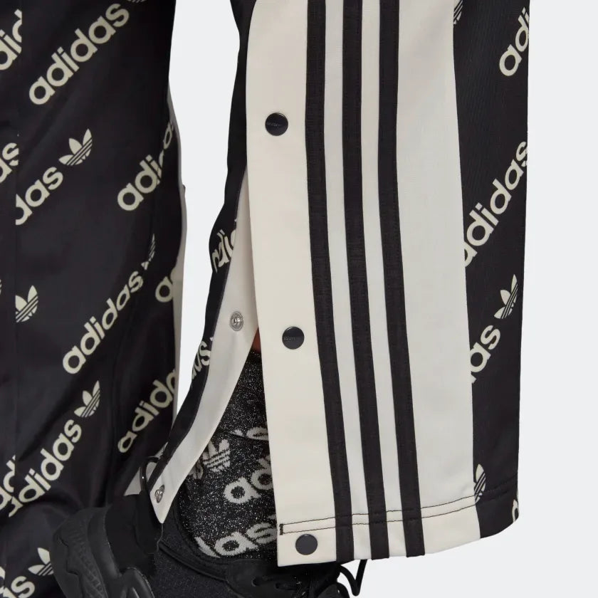 Close up showing the poppers open at the foot of the pants