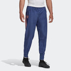 Front image showing the pants being worn with cuffed ankles and the arsenal logo